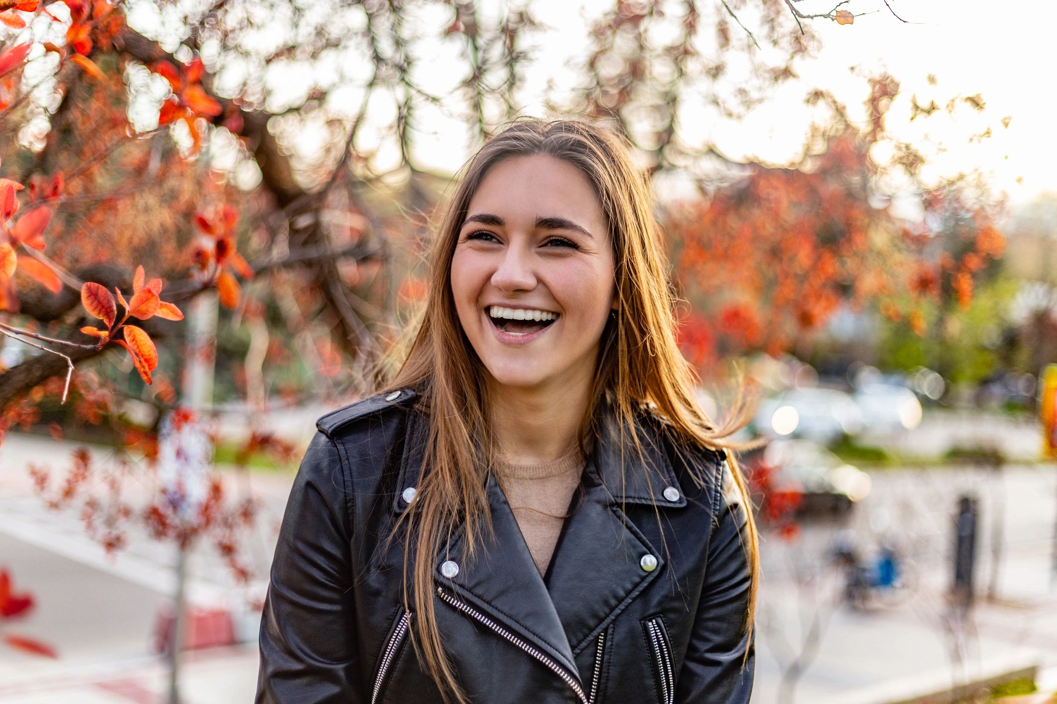 Smiling woman outdoors at sunset